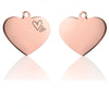 Two rose gold heart-shaped stainless steel pet ID tags with a small heart engraving